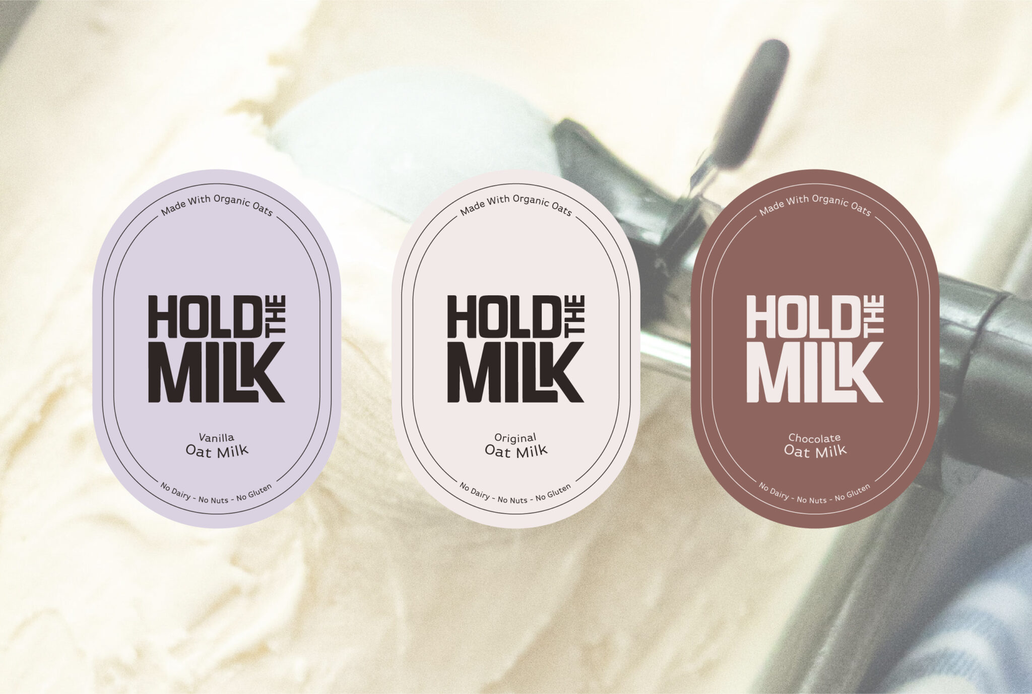 Hold the Milk Oat Milk labels. Ice cream background.